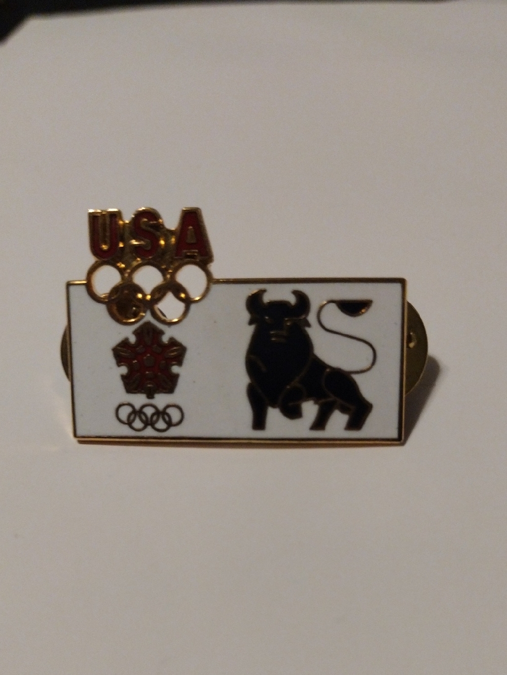 USA Winter Olympics Merrill Lynch Bull Enamel Pin - White, Black, Red, Gold 1984